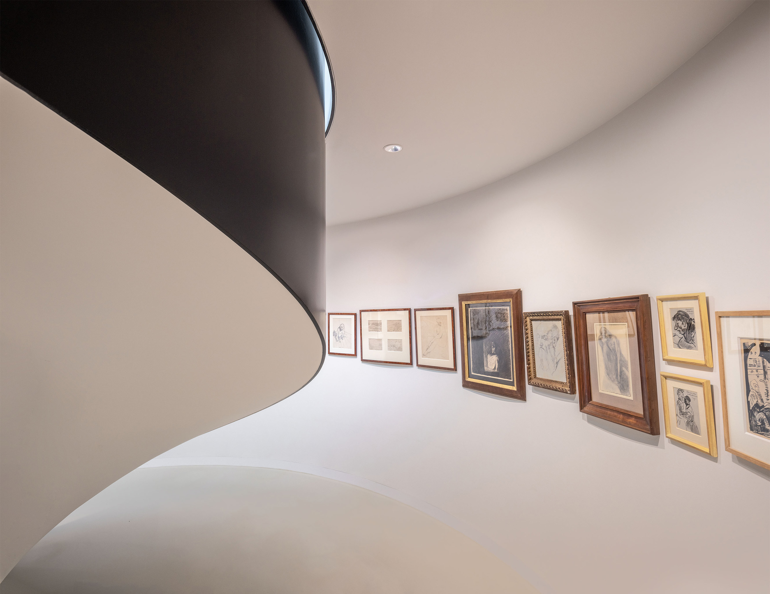 Sculptural stairs with art collection